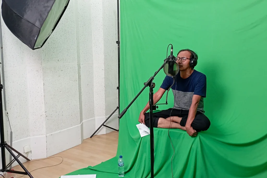 Behind the scenes of BELIK: Faisal Kamandobat recording voice-over narration directed by Samuel Indratma.